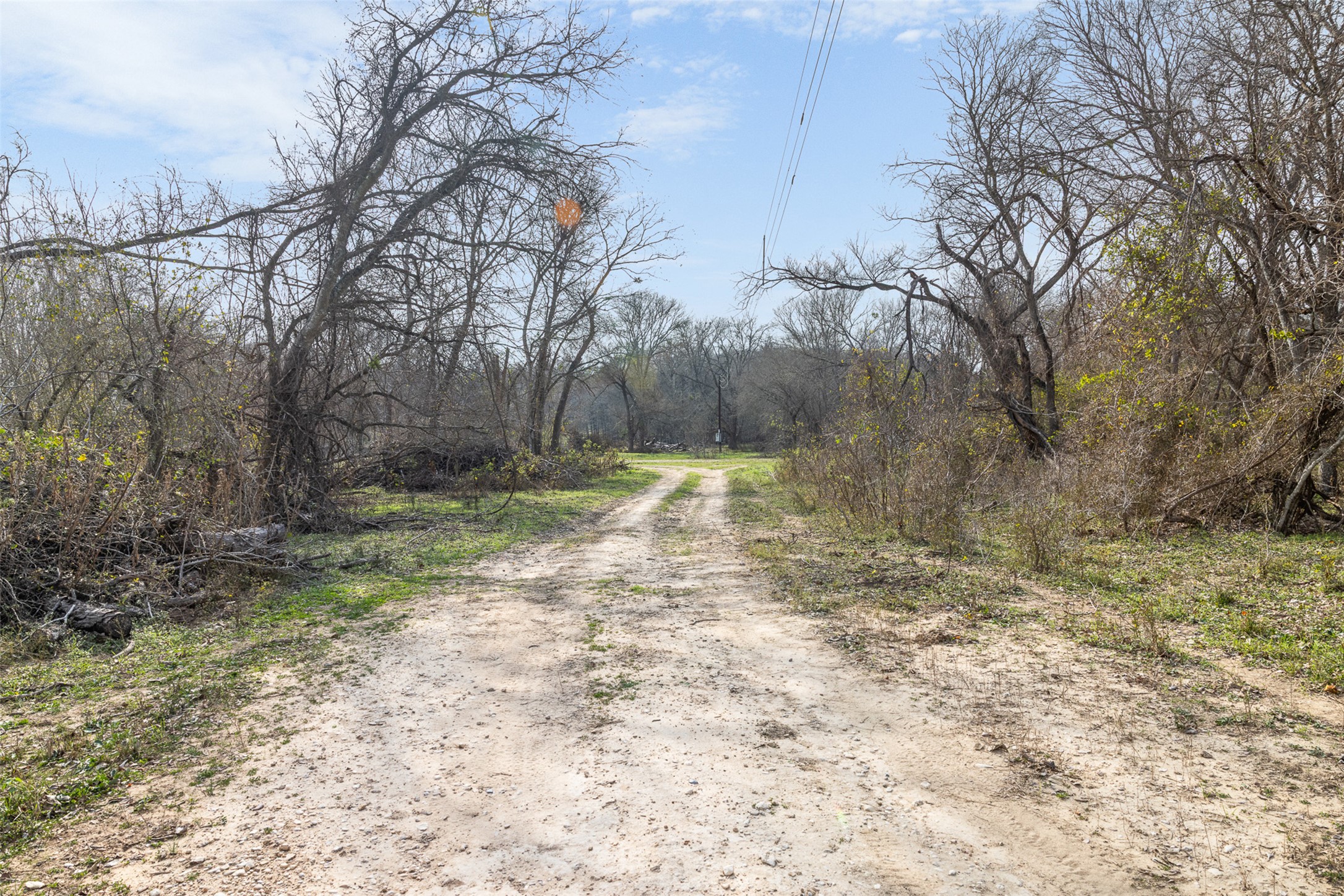 1144 Treetop Lane Luling, TX 78648 - Photo 6 of 31 View of dirt / gravel road