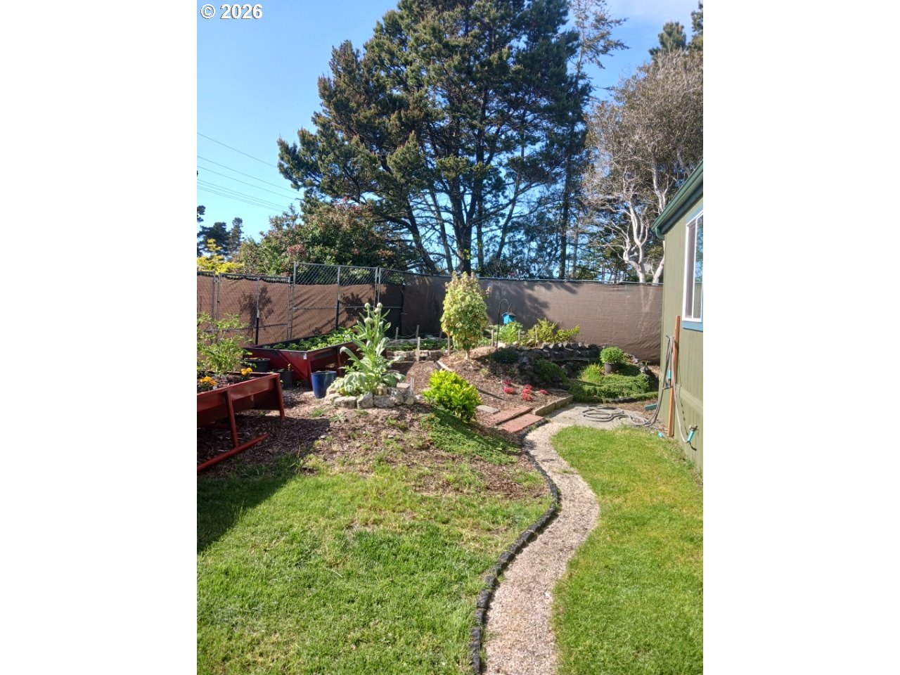 3760 Highway 101, Unit 1 Florence, OR 97439 - Photo 29 of 32 a view of a backyard with sitting area