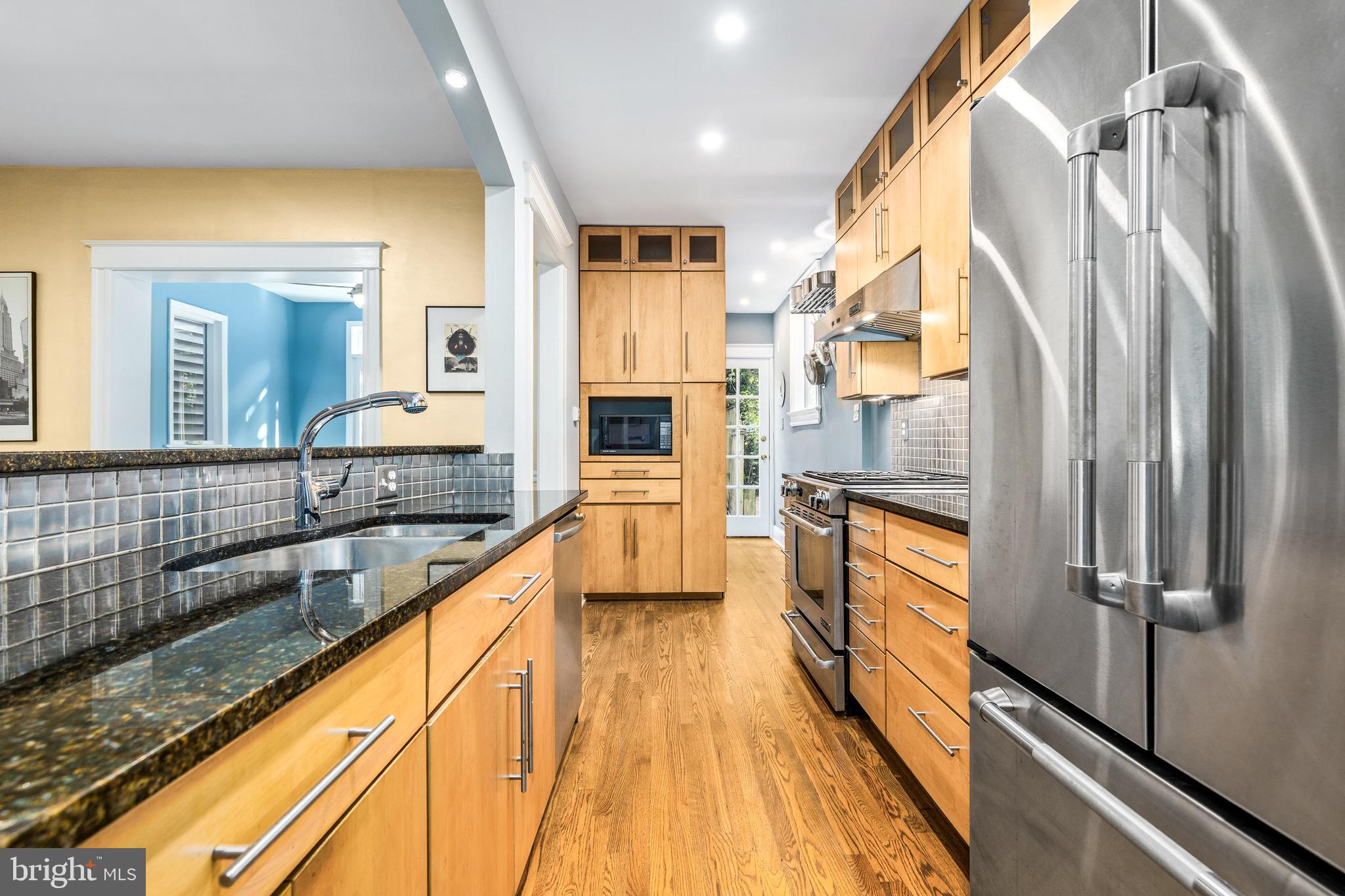 1716 Irving Street Northwest Washington, DC 20010 - Photo 12 of 43 a view of a living room with a large window