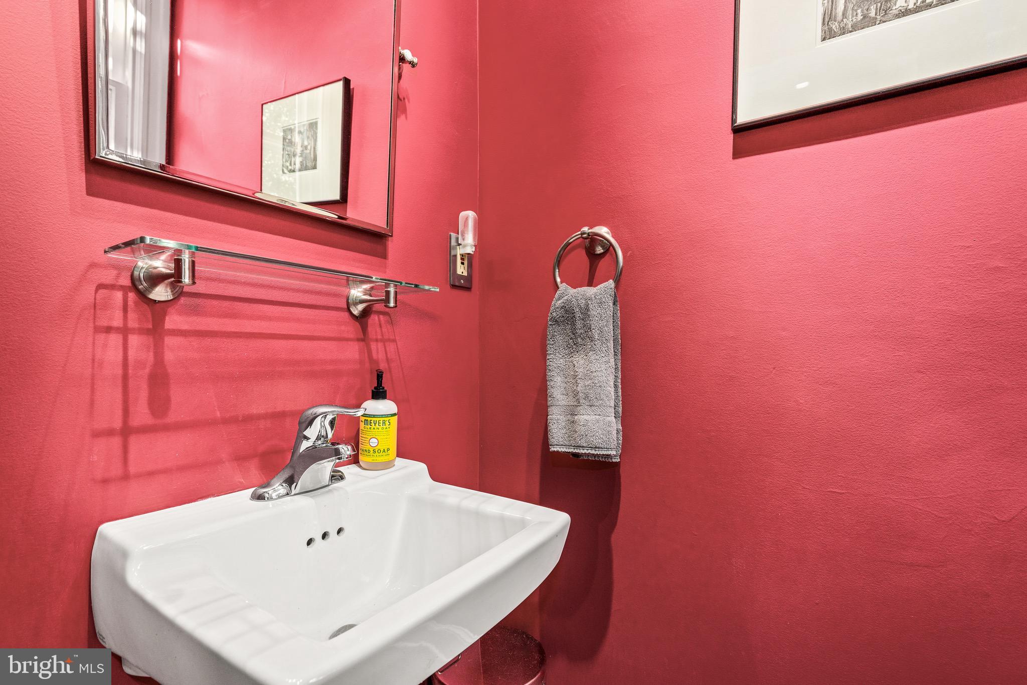 1716 Irving Street Northwest Washington, DC 20010 - Photo 14 of 43 a bathroom with a sink and a mirror