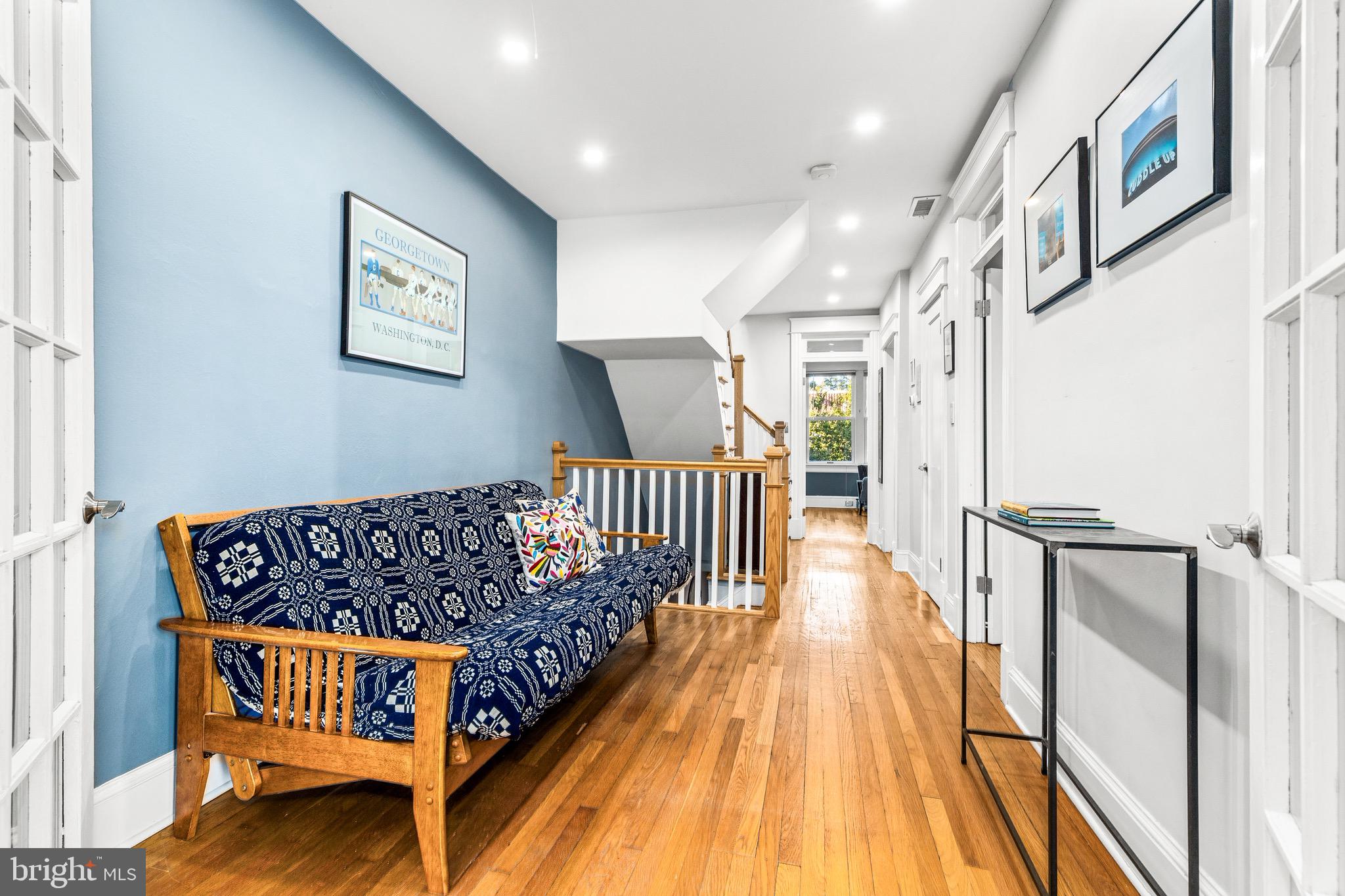 1716 Irving Street Northwest Washington, DC 20010 - Photo 18 of 43 a bed room with furniture and wooden floor