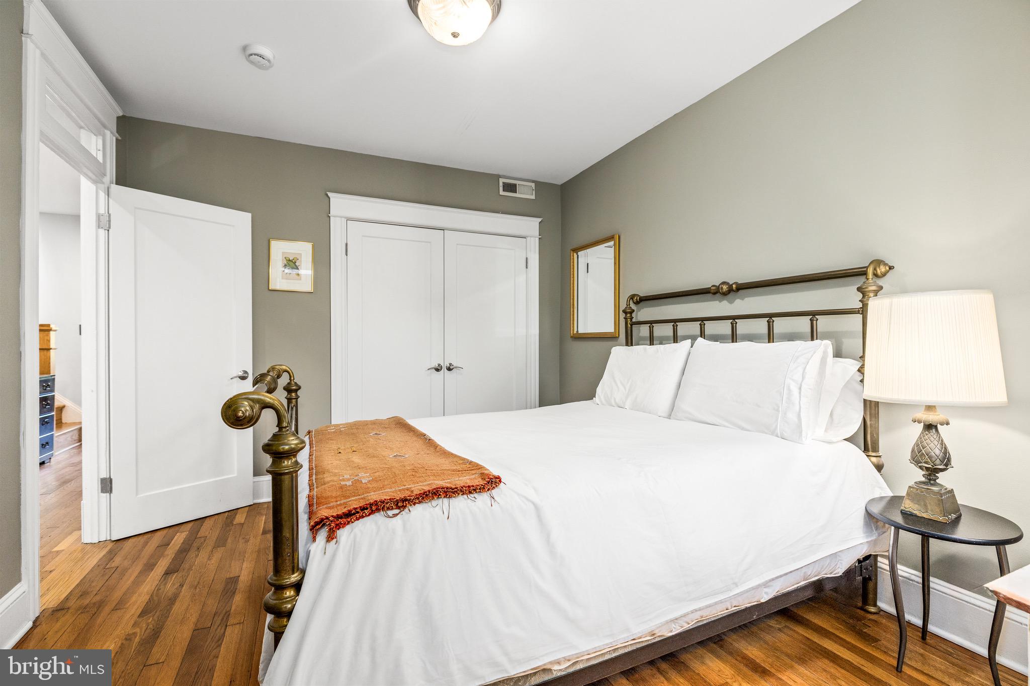 1716 Irving Street Northwest Washington, DC 20010 - Photo 22 of 43 a bedroom with a bed and a window