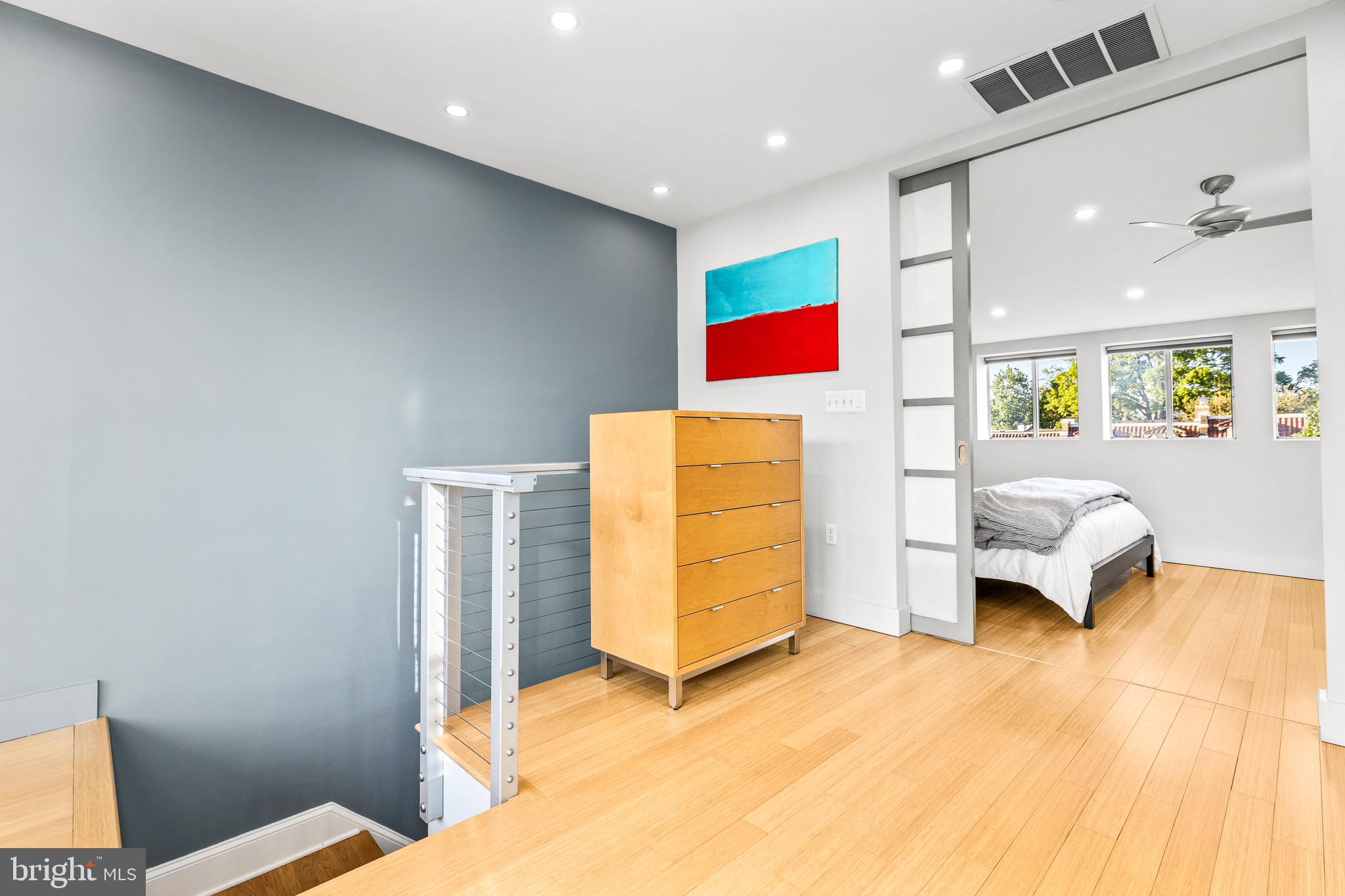 1716 Irving Street Northwest Washington, DC 20010 - Photo 25 of 43 a bedroom with a bed and a couch