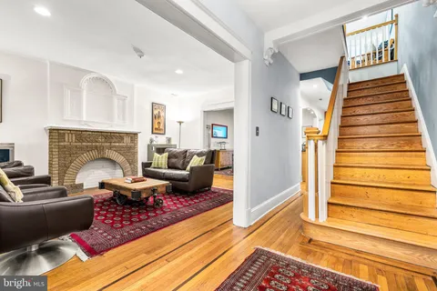 a living room with furniture or couch and a fireplace