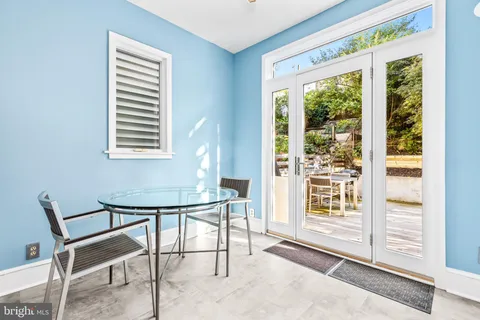 a view of a room that has a window and outside view