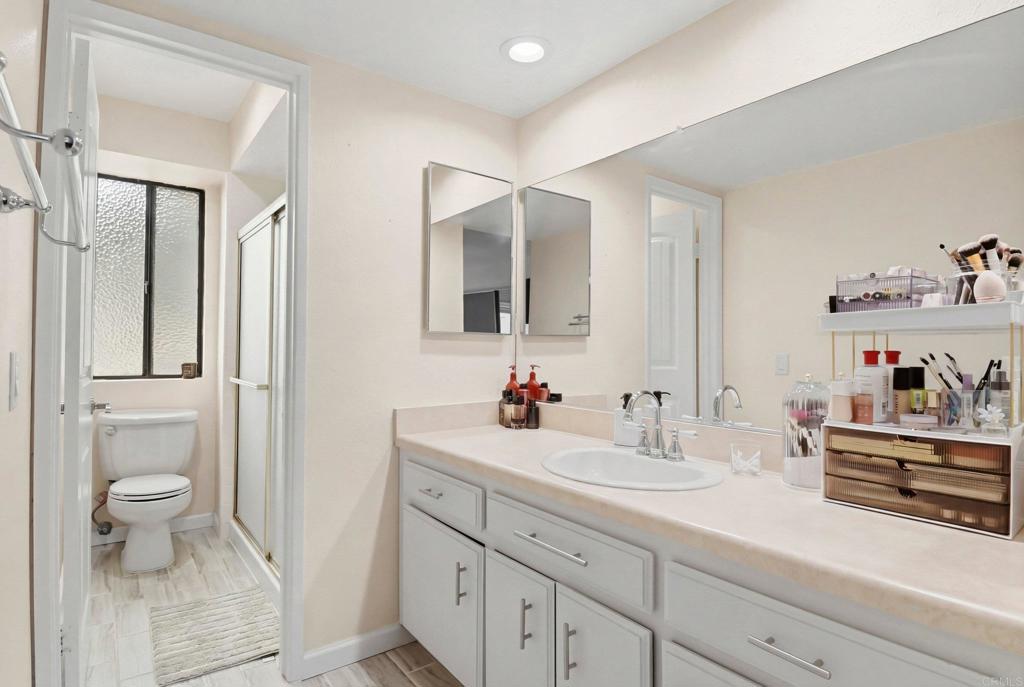 1988 Arnold Way Alpine, CA 91901 - Photo 17 of 22 a bathroom with a sink a toilet and a mirror