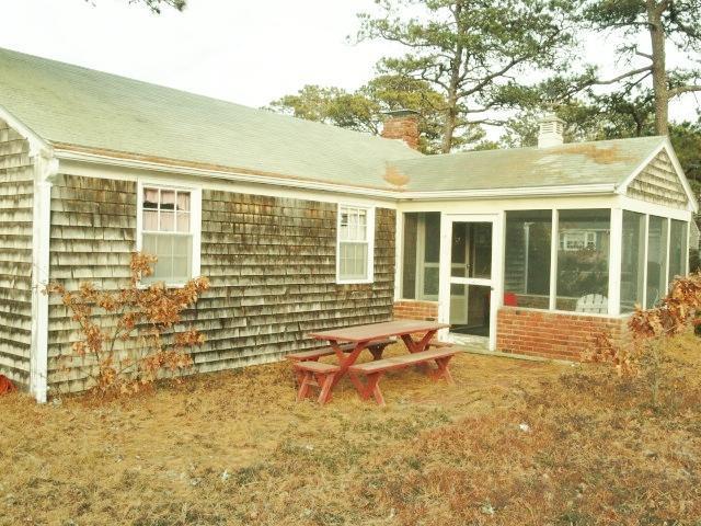 61 Lawrence Road Dennis Port, MA 02639 - Photo 14 of 14 a swimming pool with outdoor seating and yard