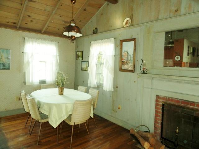 61 Lawrence Road Dennis Port, MA 02639 - Photo 5 of 14 a view of a dining room with furniture and wooden floor