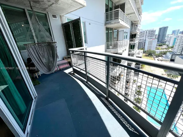a view of balcony with furniture