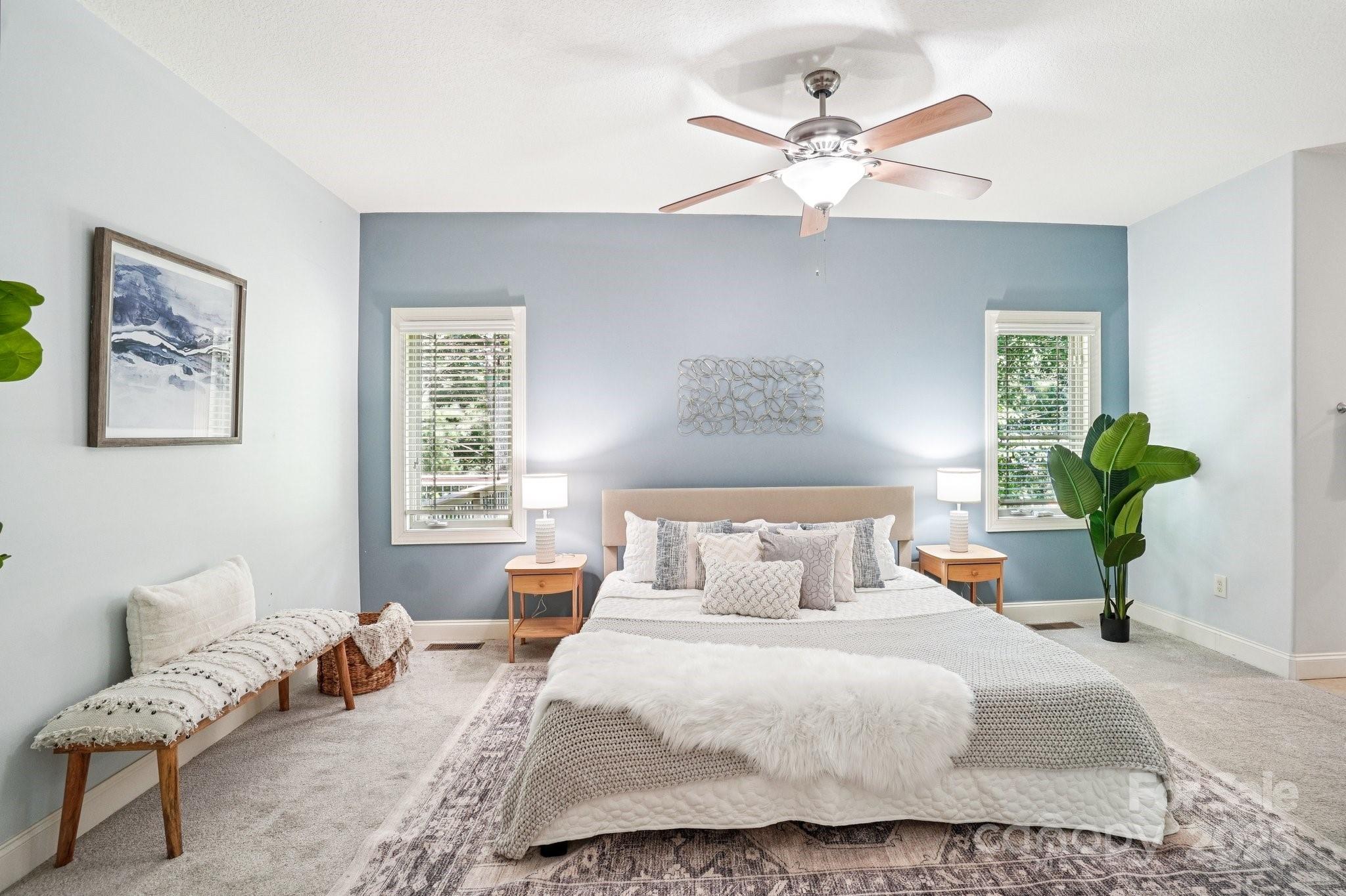 147 Cedar Lane Arden, NC 28704 - Photo 16 of 48 a bedroom with a bed couches and window