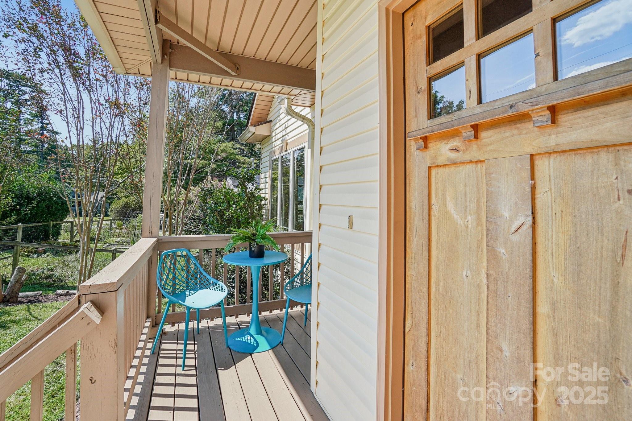 147 Cedar Lane Arden, NC 28704 - Photo 3 of 48 a view of balcony with chairs and wooden fence