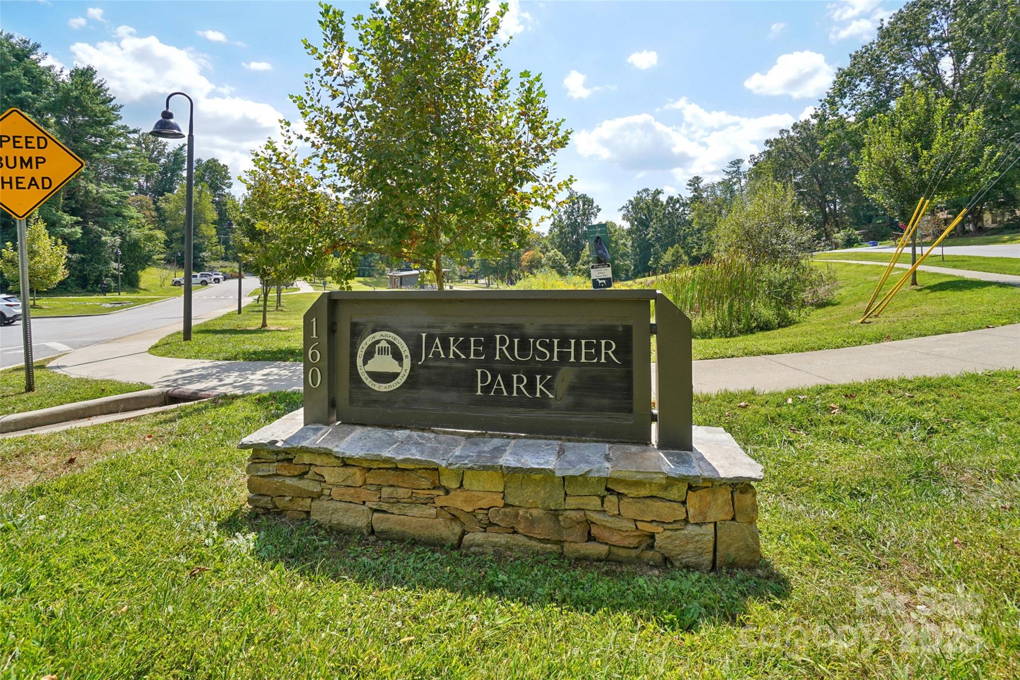 147 Cedar Lane Arden, NC 28704 - Photo 40 of 48 a view of a park with welcome board