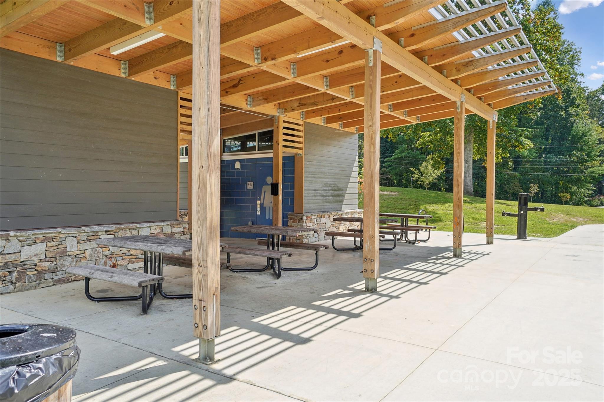 147 Cedar Lane Arden, NC 28704 - Photo 44 of 48 a view of a patio with table and chairs and potted plants