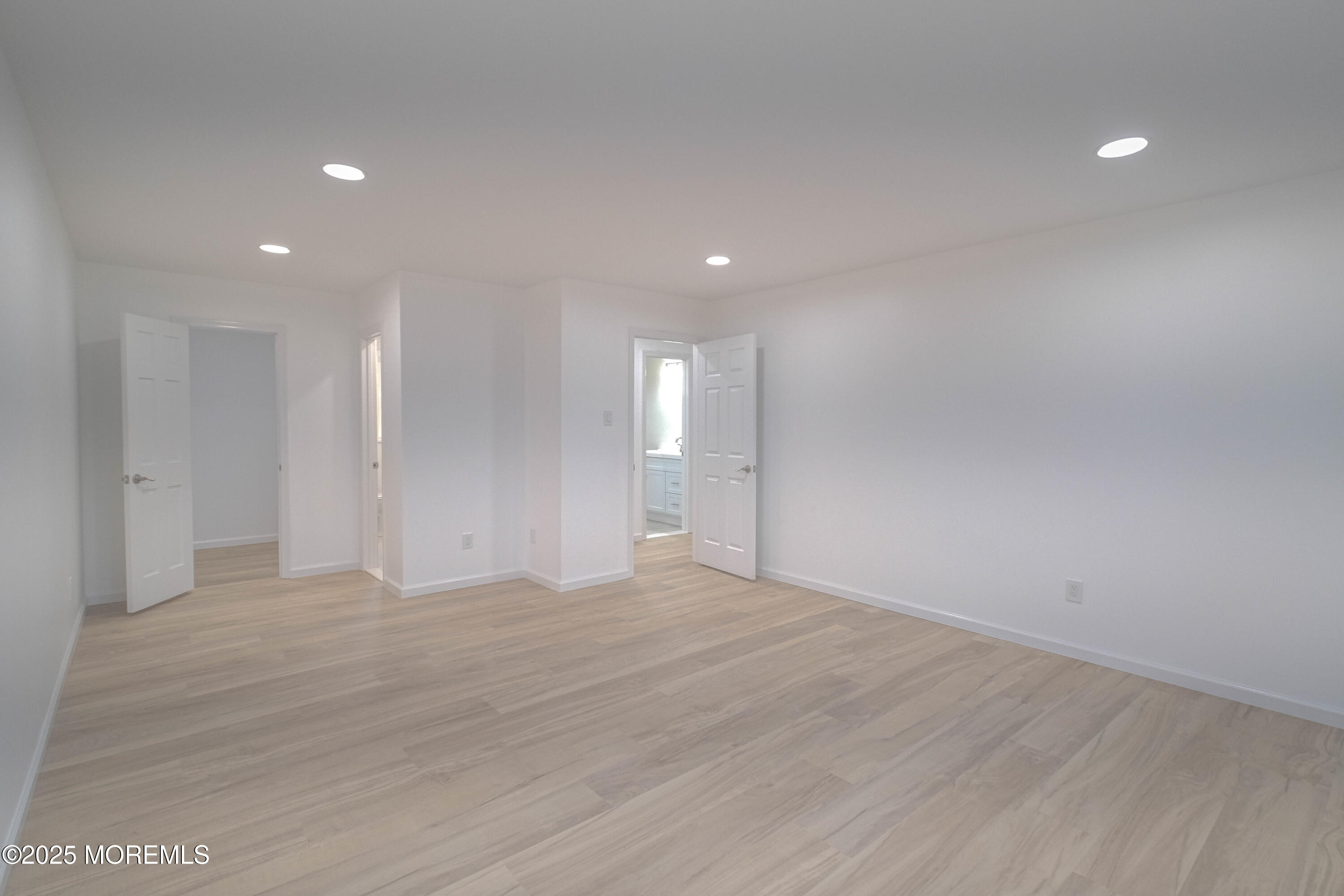 125 Shore Road Marmora, NJ 08223 - Photo 11 of 27 a view of an empty room with wooden floor and a window