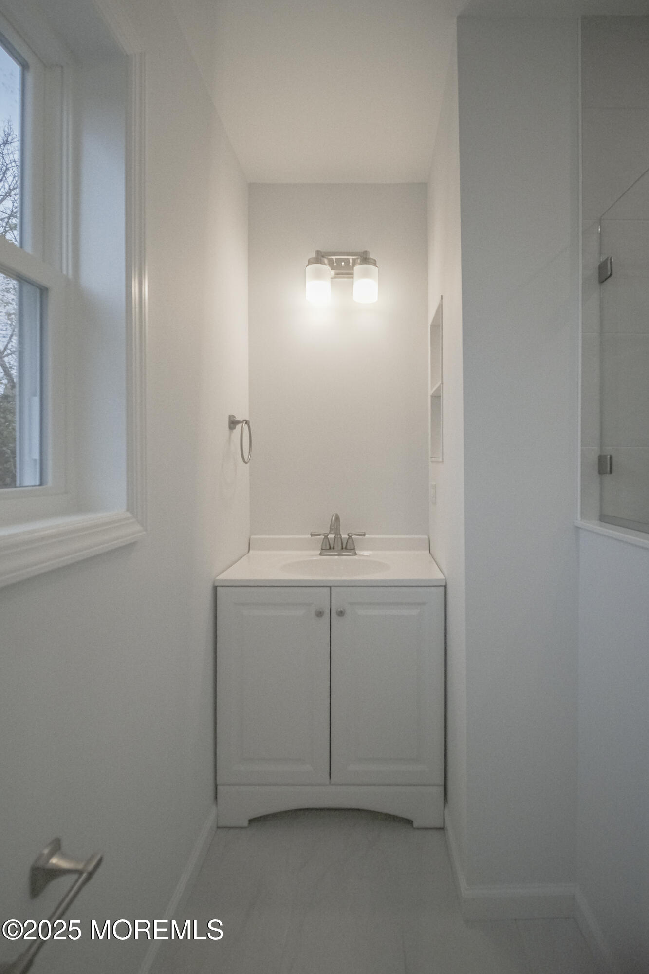 125 Shore Road Marmora, NJ 08223 - Photo 12 of 27 a bathroom with a sink vanity and a mirror