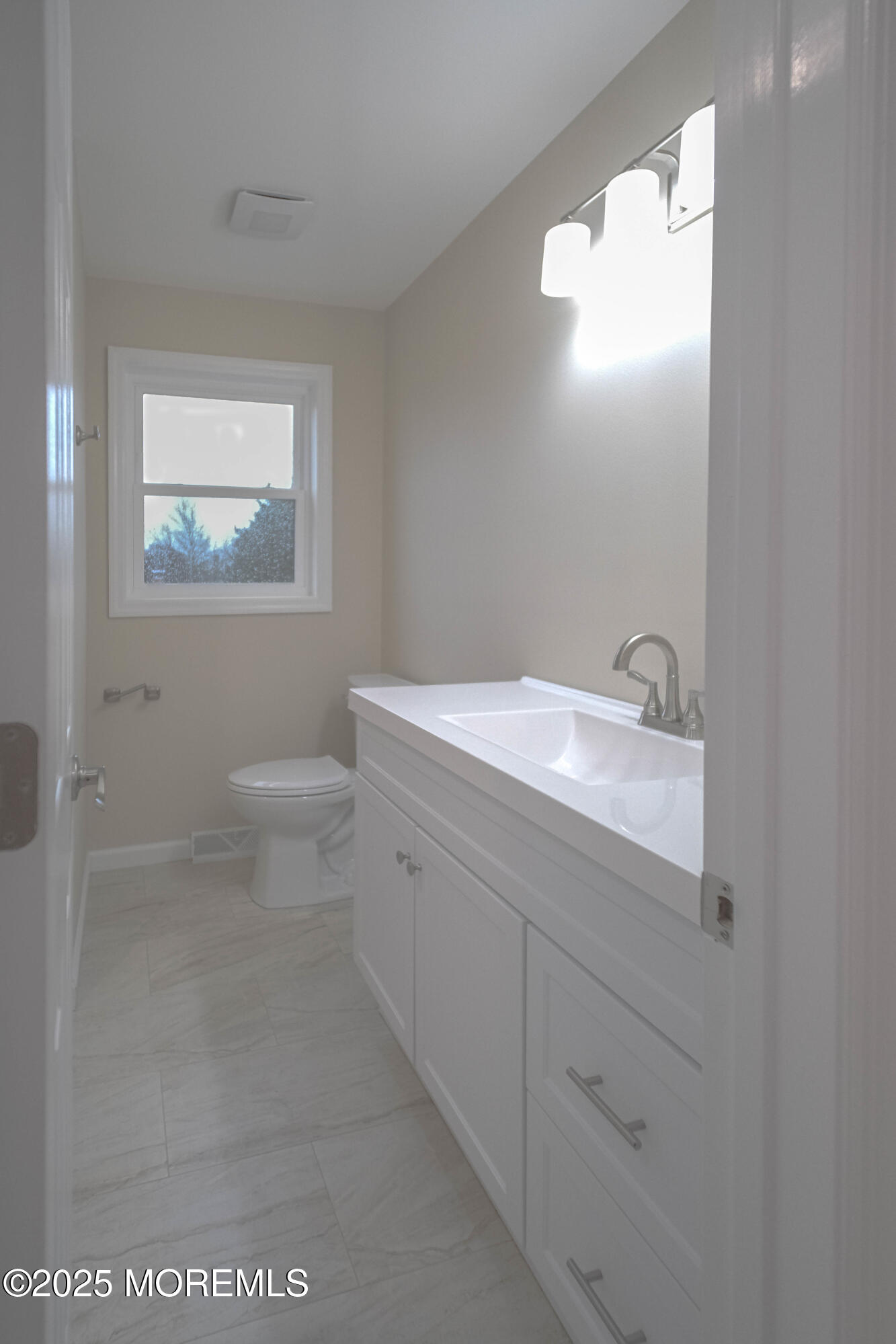 125 Shore Road Marmora, NJ 08223 - Photo 19 of 27 a bathroom with a sink a toilet and a mirror