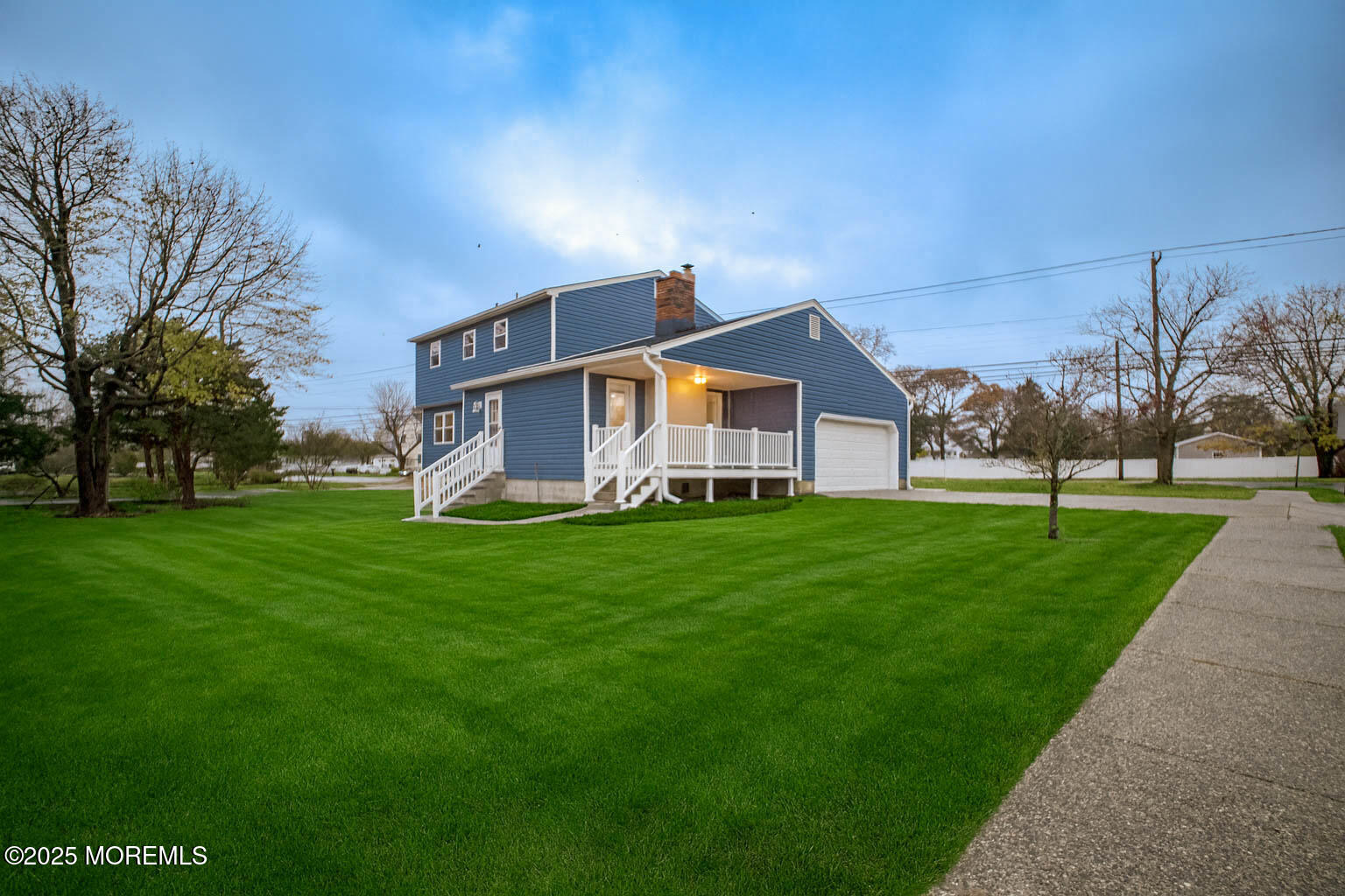 125 Shore Road Marmora, NJ 08223 - Photo 25 of 27 a front view of house with yard and green space