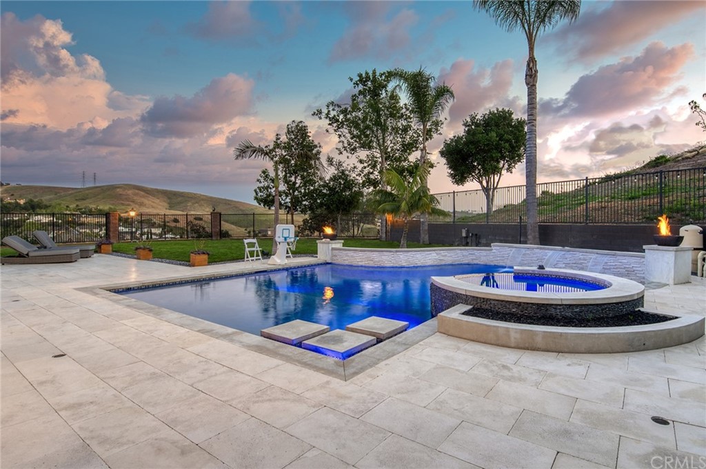 11 Epona Way Ladera Ranch, CA 92694 - Photo 13 of 41 a view of swimming pool with a table and chairs
