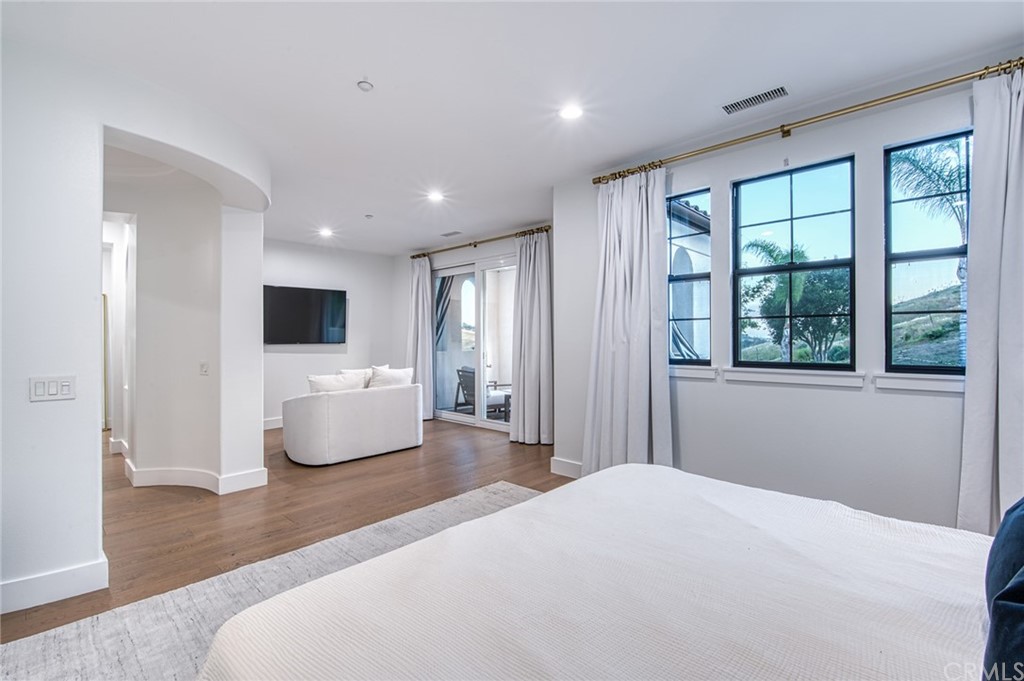 11 Epona Way Ladera Ranch, CA 92694 - Photo 17 of 41 a bedroom with a bed and a television