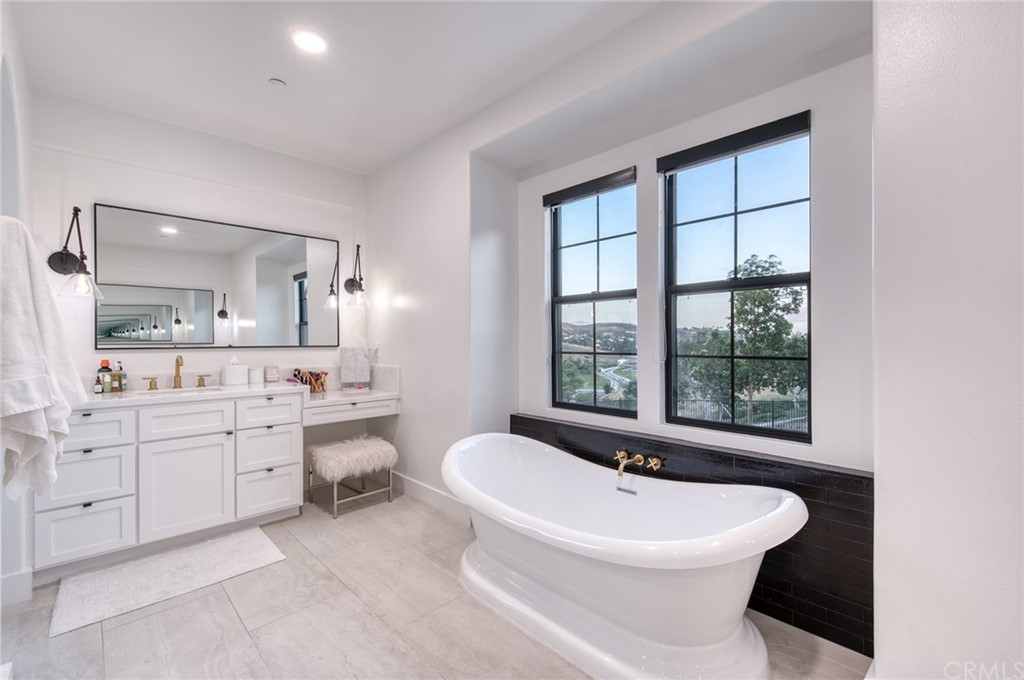 11 Epona Way Ladera Ranch, CA 92694 - Photo 18 of 41 a white toilet sitting next to a bathroom sink