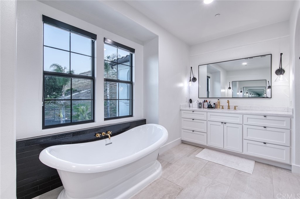 11 Epona Way Ladera Ranch, CA 92694 - Photo 20 of 41 a bathroom with a sink and a bathtub
