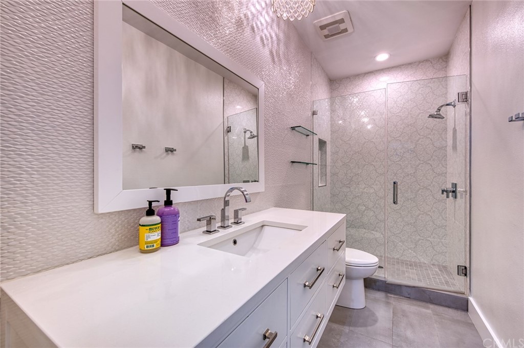 11 Epona Way Ladera Ranch, CA 92694 - Photo 22 of 41 a bathroom with a double vanity sink toilet and shower