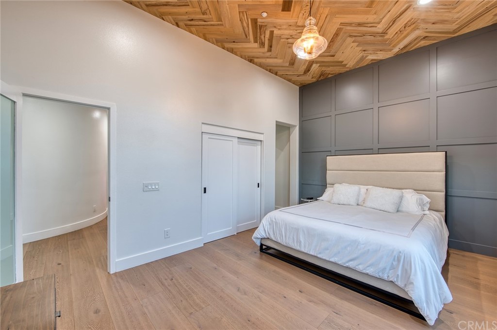 11 Epona Way Ladera Ranch, CA 92694 - Photo 25 of 41 a bedroom with a bed and a chandelier