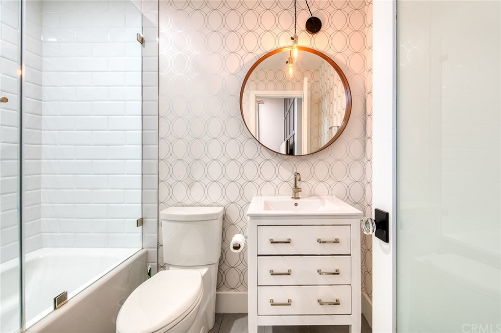 11 Epona Way Ladera Ranch, CA 92694 - Photo 26 of 41 a bathroom with a sink a toilet and a mirror