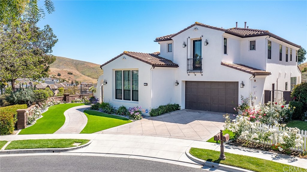 11 Epona Way Ladera Ranch, CA 92694 - Photo 29 of 41 a front view of a house with a garden and plants