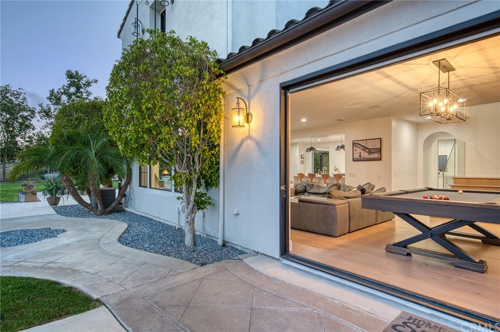 11 Epona Way Ladera Ranch, CA 92694 - Photo 4 of 41 a living room with patio furniture and a potted plant