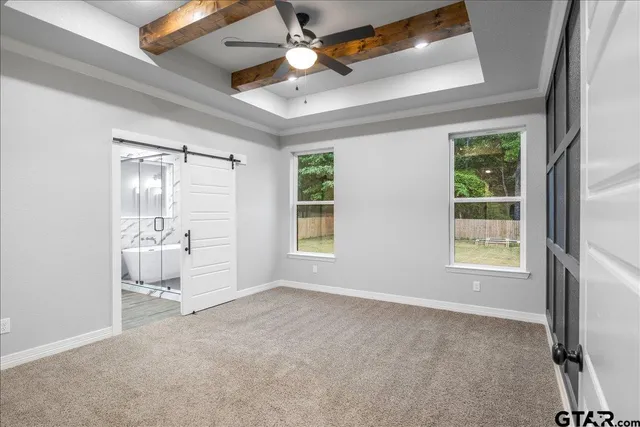 a bathroom with a granite countertop sink mirror and shower