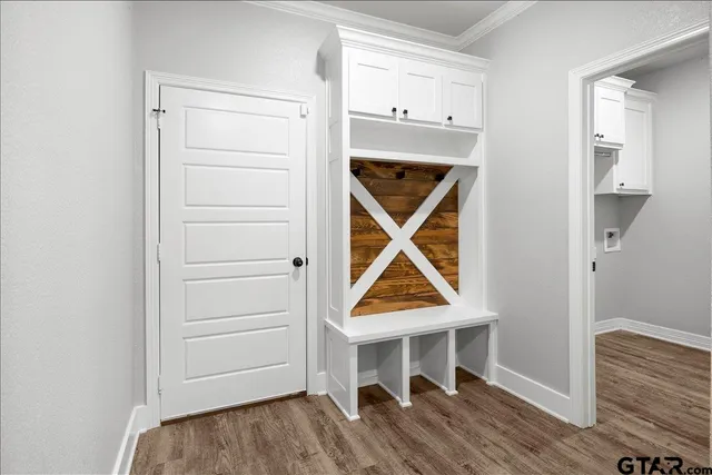 a bathroom with a granite countertop sink toilet and shower a mirror