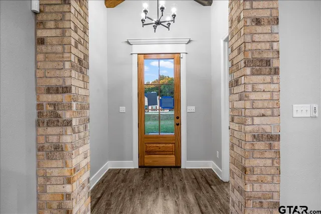 a view of kitchen with wooden floor and windows