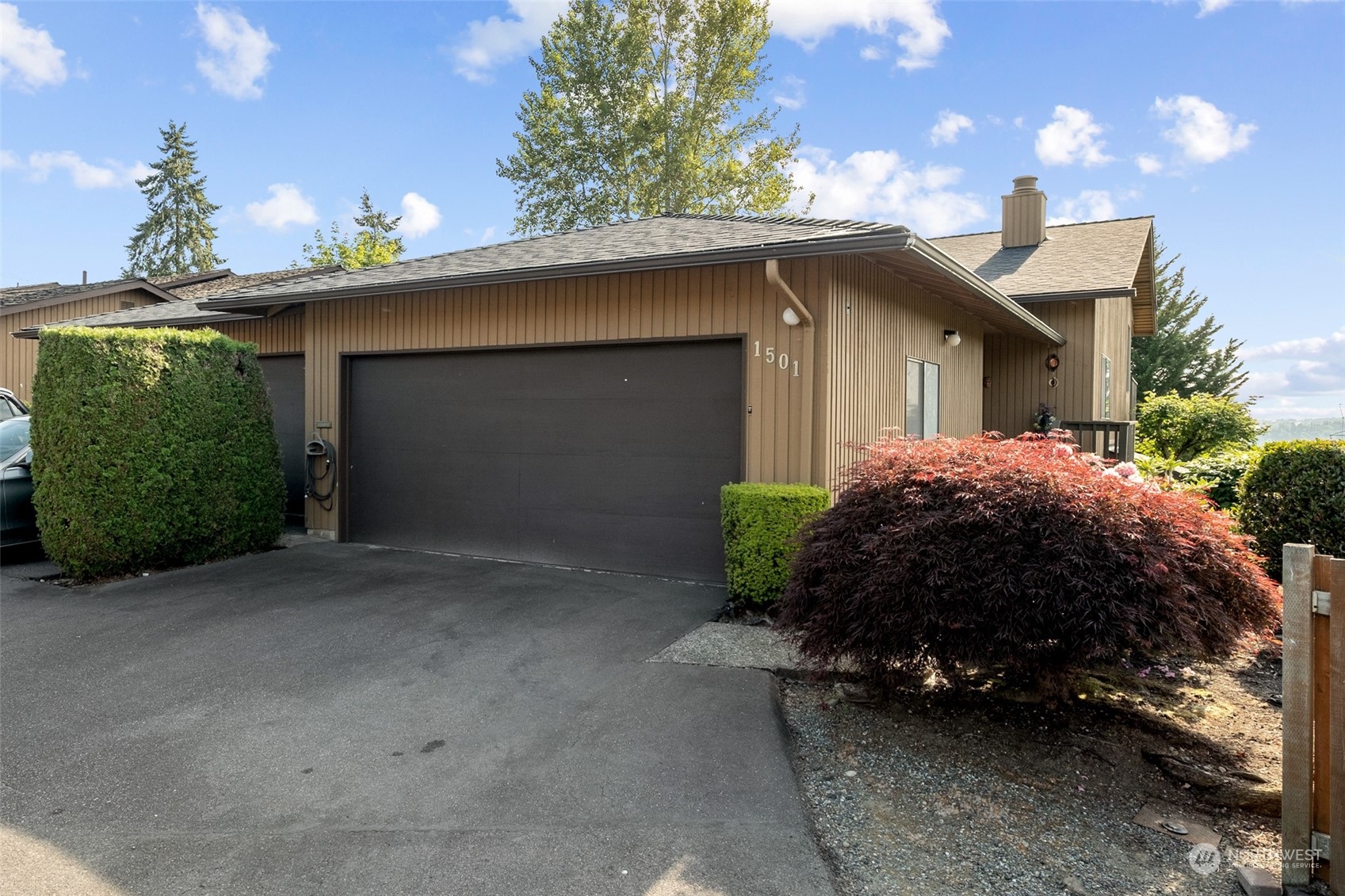 1501 Eagle Ridge Drive South, Unit G5 Renton, WA 98055 - Photo 1 of 23 a house view with a garden space