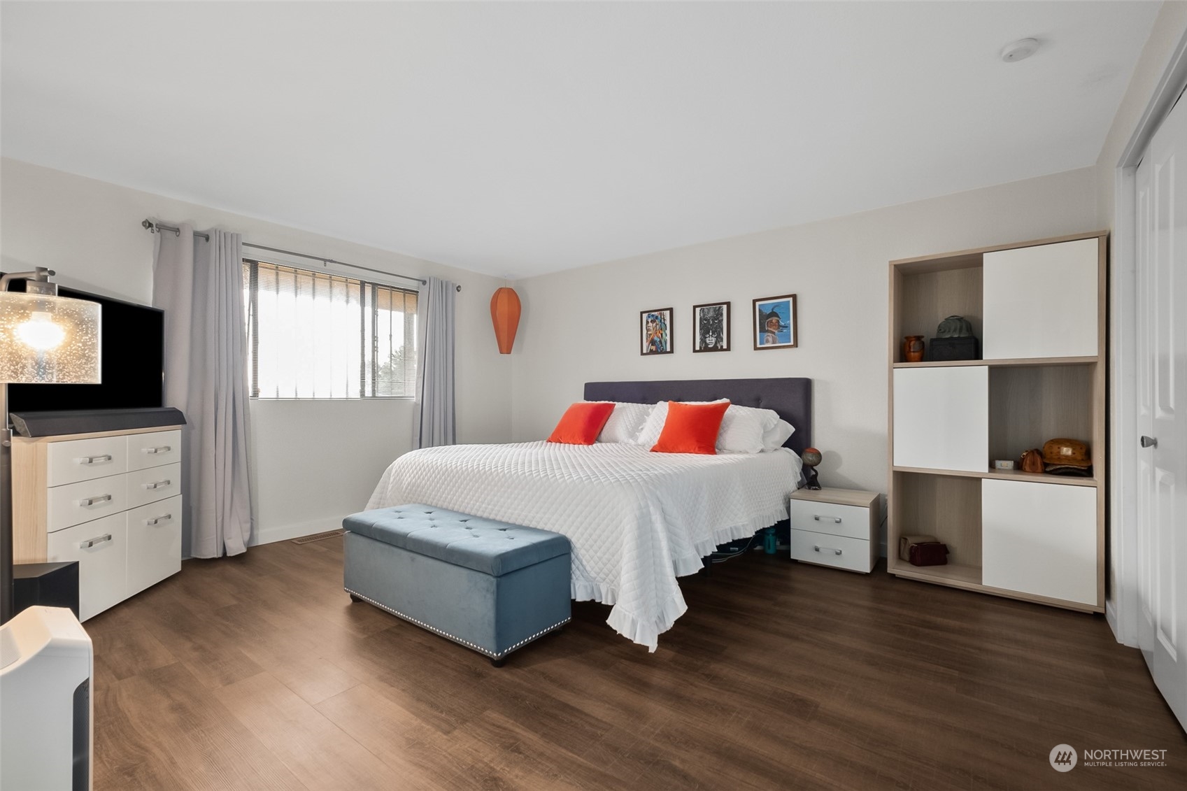 1501 Eagle Ridge Drive South, Unit G5 Renton, WA 98055 - Photo 17 of 23 a bedroom with a bed and a flat tv screen on the dresser