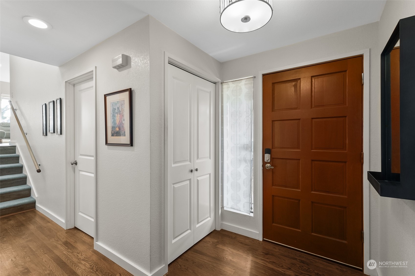 1501 Eagle Ridge Drive South, Unit G5 Renton, WA 98055 - Photo 3 of 23 a view of a hallway with wooden floor and entryway