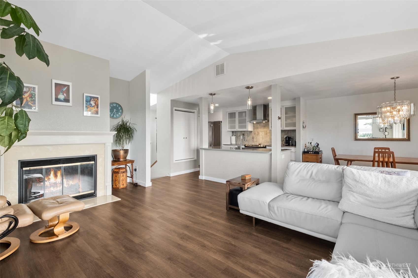 1501 Eagle Ridge Drive South, Unit G5 Renton, WA 98055 - Photo 9 of 23 a living room with furniture and a fireplace