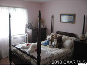 3272 Hermitage Road Waynesboro, VA 22980 - Photo 11 of 12 a bedroom with a bed and a painting on the wall