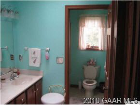 3272 Hermitage Road Waynesboro, VA 22980 - Photo 9 of 12 a bathroom with a toilet sink vanity and mirror