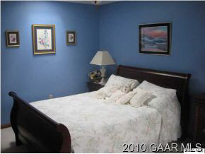 3272 Hermitage Road Waynesboro, VA 22980 - Photo 10 of 12 a bedroom with a bed and a painting on the wall