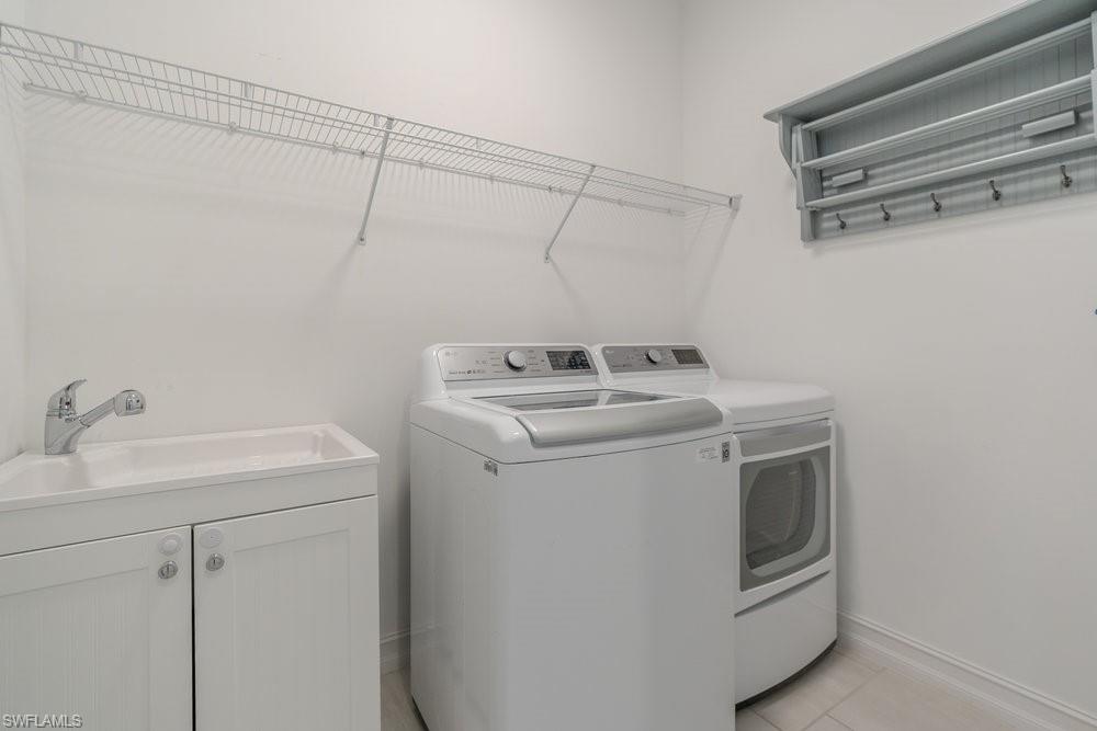 16374 Barclay Court Naples, FL 34110 - Photo 23 of 32 a utility room with dryer and washer
