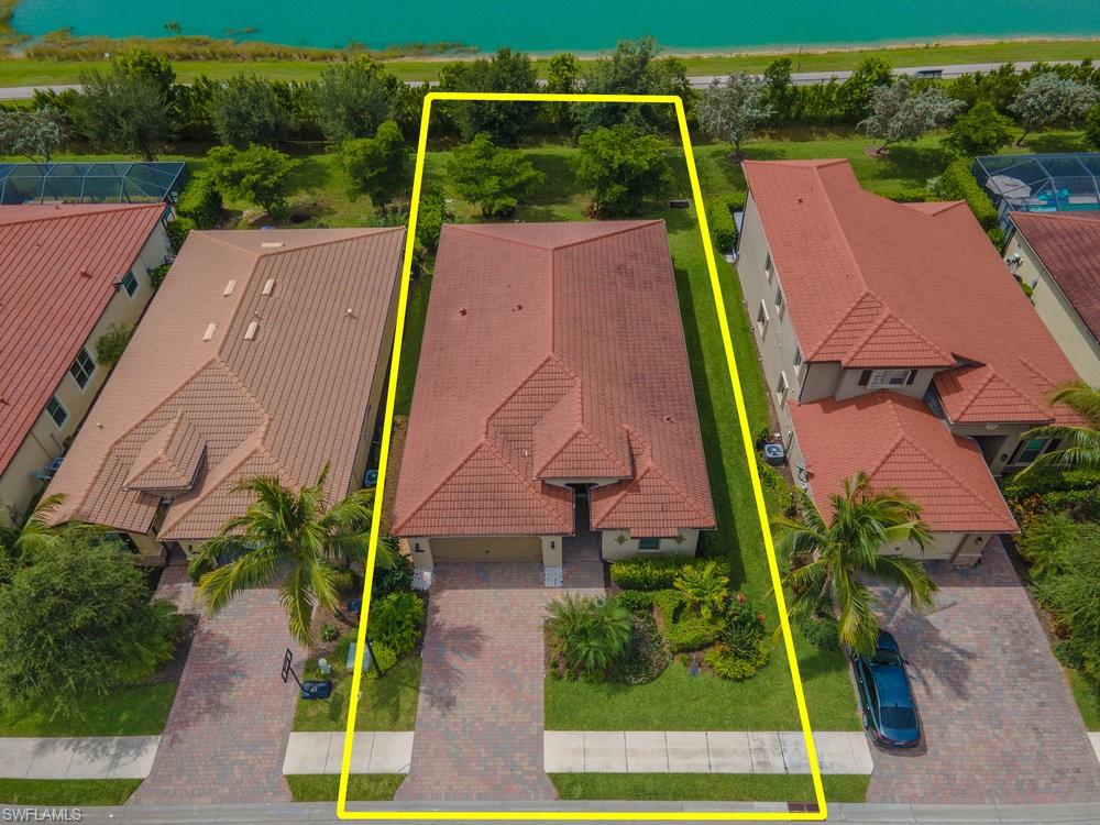 16374 Barclay Court Naples, FL 34110 - Photo 29 of 32 an aerial view of a house with a yard and potted plants