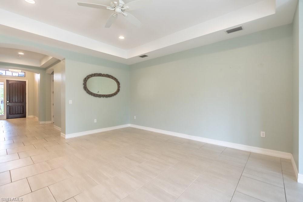 16374 Barclay Court Naples, FL 34110 - Photo 6 of 32 a view of a room with a fan