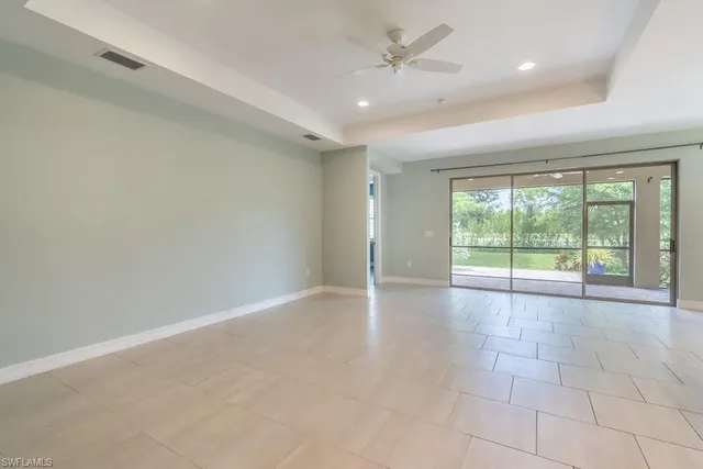 a view of kitchen with stainless steel appliances refrigerator oven and cabinets