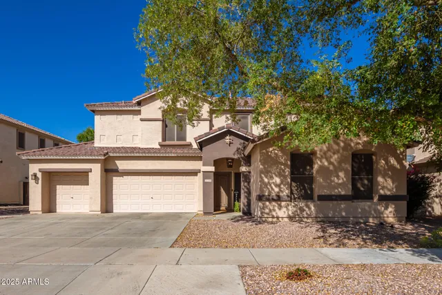 front view of a house with a trees