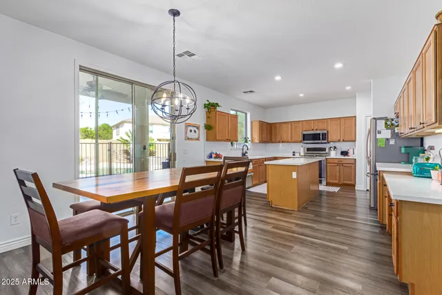 a dining room filled with furniture and window