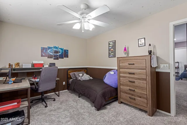 a bedroom with a bed and furniture