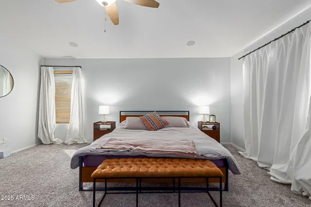 a bedroom with a bed and window