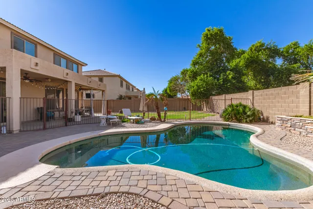 a view of a swimming pool with a patio