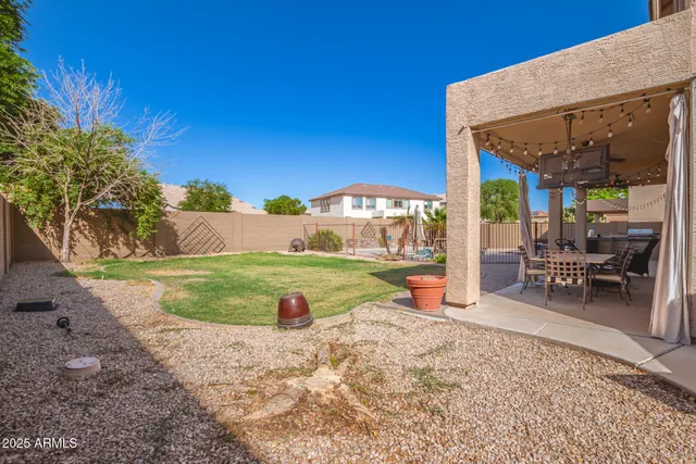 a view of a backyard with a patio